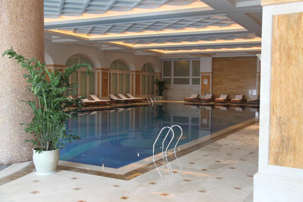 Landison Green Town Hotel Xinchang المظهر الخارجي الصورة